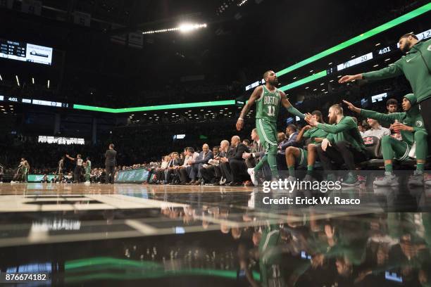 Boston Celtics Kyrie Irving shaking hands with teammates on bench during game vs Brooklyn Nets at Barclays Center. Brooklyn, NY CREDIT: Erick W. Rasco