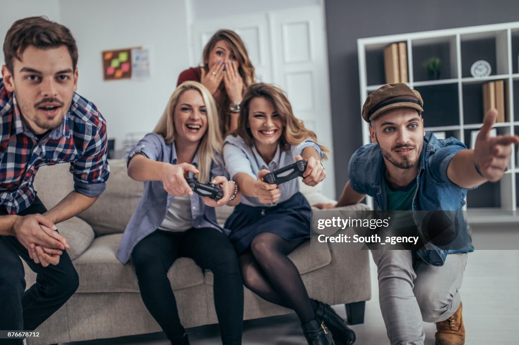 Young business people playing video games in the office