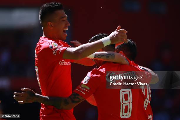 Jesus Mendez of Toluca celebrates with teammates after scoring the third goal of his team during the 17th round match between Toluca and Tijuana as...