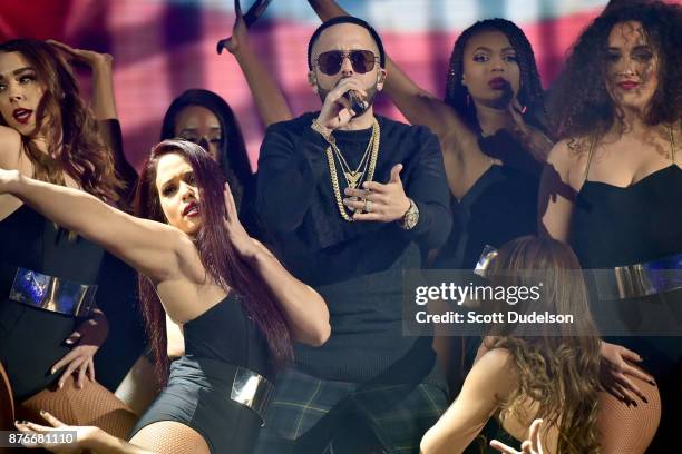 Singer Yandel performs onstage during Uforia's "K-Love Live" concert at The Forum on November 19, 2017 in Inglewood, California.