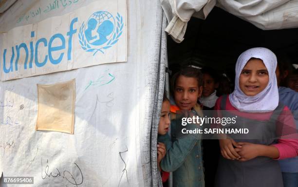 Displaced Iraqi children from the former embattled city of Mosul are seen at a United Nations Children's Fund school at the Hasan Sham camp, some 40...