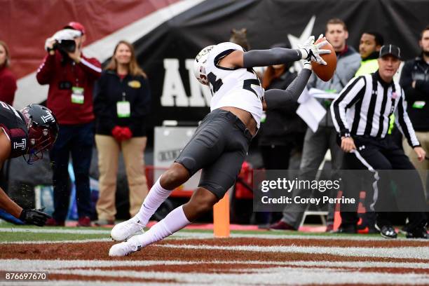 Tre Neal of the UCF Knights can't grab a potential interception against Keith Kirkwood of the Temple Owls during the first quarter at Lincoln...