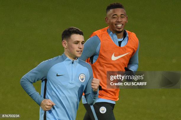 Manchester City's English midfielder Phil Foden and Manchester City's Brazilian striker Gabriel Jesus take part in a team training session at the...