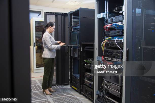 female it professional in server room - suit rack stock pictures, royalty-free photos & images