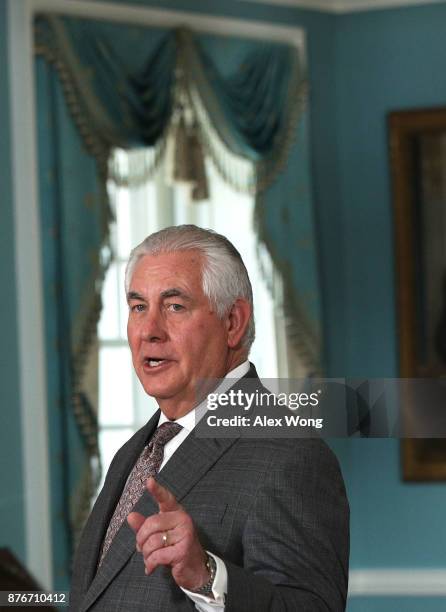 Secretary of State Rex Tillerson speaks as he participates in a photo opportunity with Qatari Foreign Minister Sheikh Mohammed bin Abdulrahman Al...