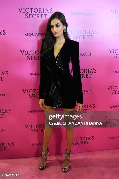 Brazilian model Gizele Oliveira poses as she arrives for the after party for the 2017 Victoria's Secret Fashion Show in Shanghai on November 20,...