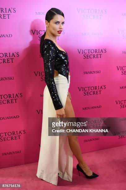 Brazilian model Adriana Lima poses as she arrives for the after party for the 2017 Victoria's Secret Fashion Show in Shanghai on November 20, 2017. /...