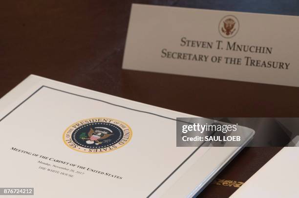 Folder for Treasury Secretary Steven Mnuchin sits on the table as US President Donald Trump holds a Cabinet Meeting in the Cabinet Room of the White...