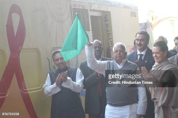 Chairperson of UPA Sonia Gandhi and Railway Minister Lalu Prasad flag off the Red Ribbon Express Train at Safdarjung Railway station in New Delhi, 01...