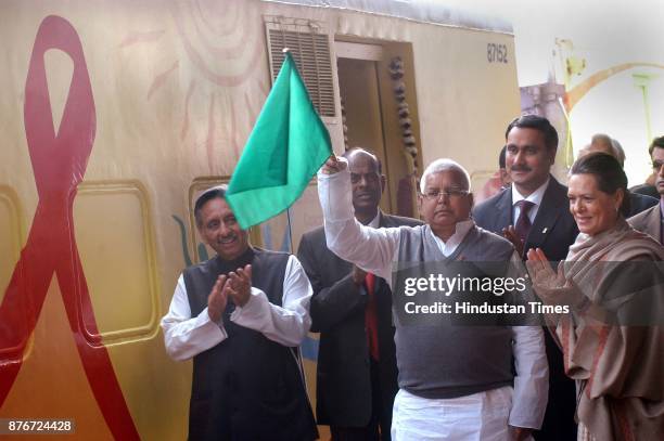 Chairperson of UPA Sonia Gandhi and Railway Minister Lalu Prasad flag off the Red Ribbon Express Train at Safdarjung Railway station in New Delhi, 01...