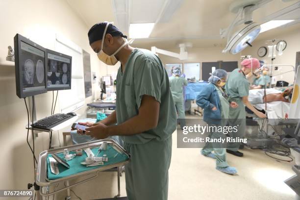 Dr. Sunit Das listens to music while doing surgeries in the operating room. He says that the music allows him to remain in the moment at all times....