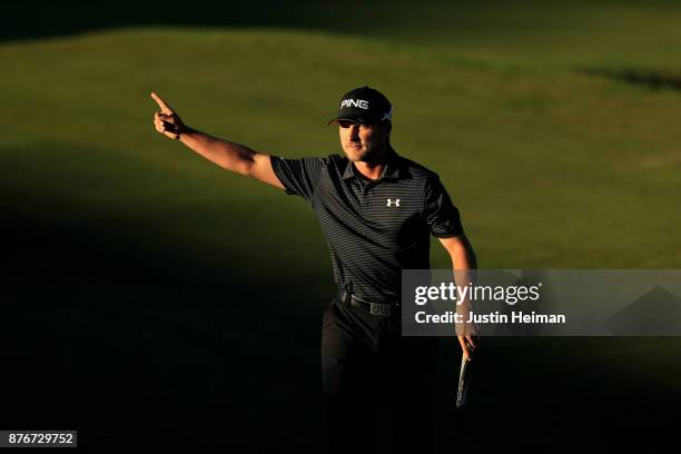 Austin Cook of United States celebrates after putting on the on the 18th green to win in the final round of The RSM Classic at Sea Island Golf Club...