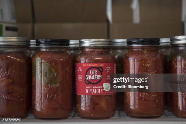 Jars of tomatoes sit on display at the City Saucery store inside the Brooklyn Army Terminal in the Brooklyn Borough of New York, U.S., on Tuesday,...