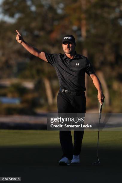 Austin Cook of United States celebrates after putting on the 18th green to win in the final round of The RSM Classic at Sea Island Golf Club Seaside...