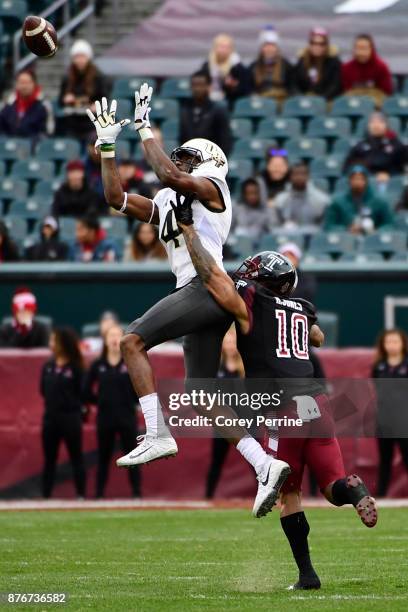 Tre'Quan Smith of the UCF Knights hauls in a reception against Mike Jones of the Temple Owls during the second quarter at Lincoln Financial Field on...