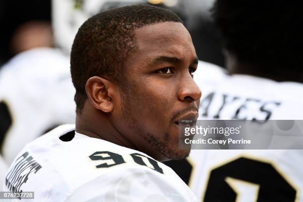 Josh Odigie of the UCF Knights looks on against the Temple Owls from the bench during the second quarter at Lincoln Financial Field on November 18,...