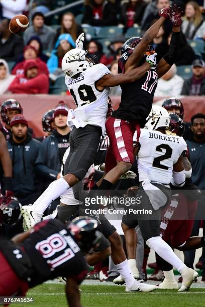 Adonis Jennings of the Temple Owls can't make reception as Mike Hughes of the UCF Knights pressures during the second quarter at Lincoln Financial...