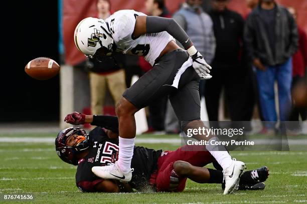 Adonis Jennings of the Temple Owls can't catch a pass as Tre Neal of the UCF Knights avoids collision during the second quarter at Lincoln Financial...