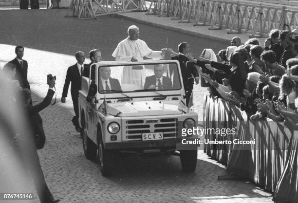Pope John Paul II greets people at the Vatican City in 1979.