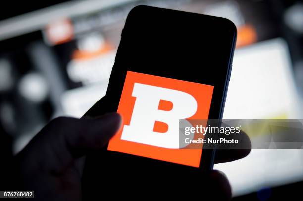 The Breitbart logo is seen on an iPhone with the Breitbart website in the background in this photo illustration on November 20, 2017.