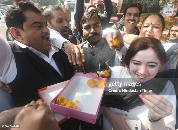 Congress worker distributes sweets after the announcement of Election of Congress President as approved by the Congress Working Committee at AICC HQ...