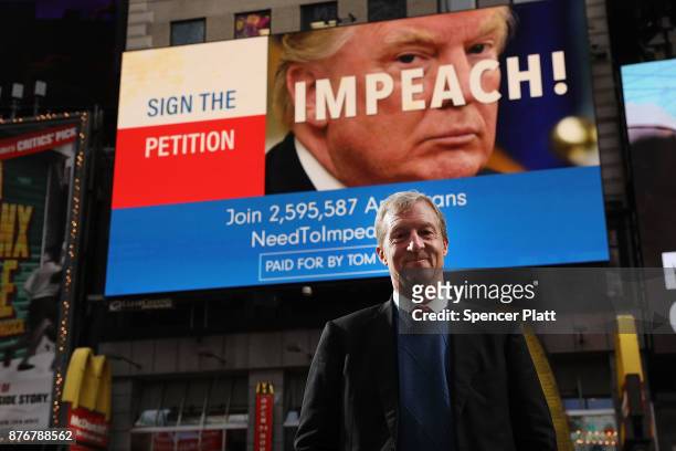 Philanthropist Tom Steyer stands in front of one of the billboards he has funded in Times Square calling for the impeachment of President Donald...