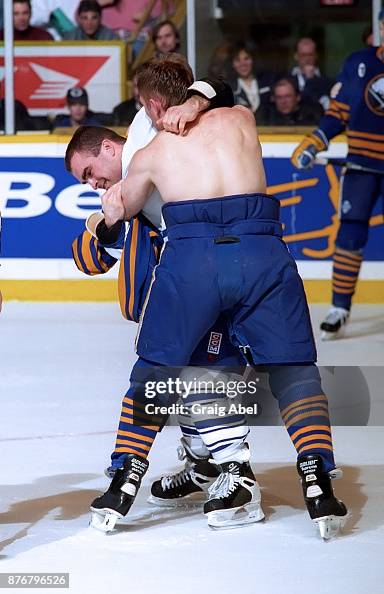 Rob Ray of the Buffalo Sabres battles with Tie Domi of the Toronto ...