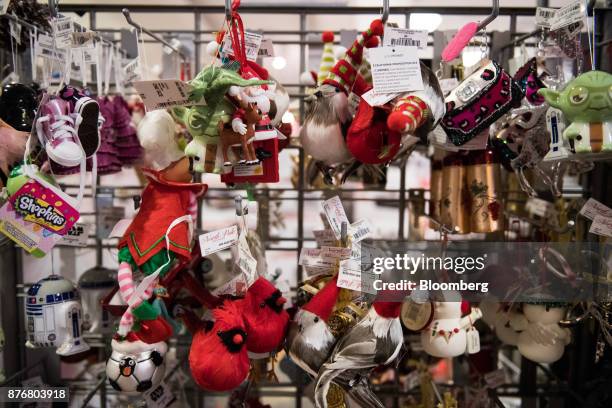 Holiday decorations hang on display for sale at a J.C. Penney Co. Store in the Queens borough of New York, U.S., on Monday, Nov. 20, 2017....