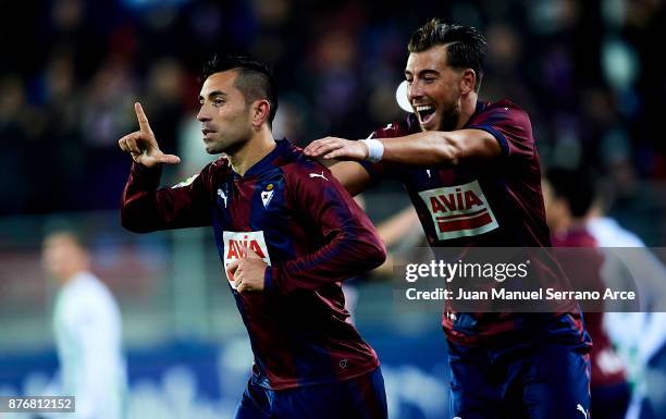 Charles Dias de Oliveira of SD Eibar celebrates with his teammates Sergi Enrich of SD Eibar after scoring his team's third goal during the La Liga...