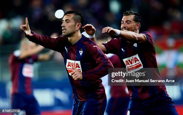 Charles Dias de Oliveira of SD Eibar celebrates with his teammates Sergi Enrich of SD Eibar after scoring his team's third goal during the La Liga...