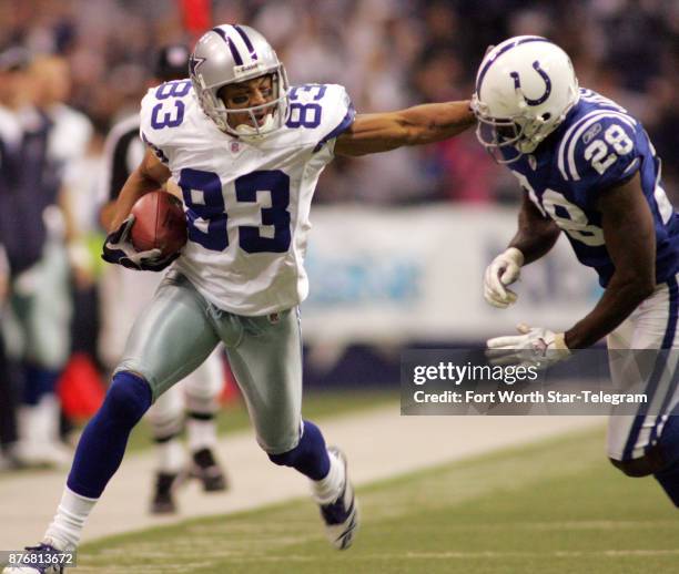 Dallas Cowboys wide receiver Terry Glenn delivers a stiff arm to Indianapolis Colts defnder Marlin Jackson late in the fourth quarter. Glenn was...