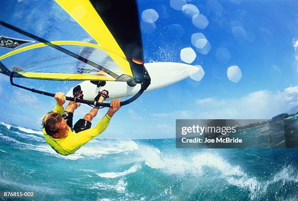 windsurfer in mid air jump, maui, hawaii, usa (wide angle) - windsurf stockfoto's en -beelden