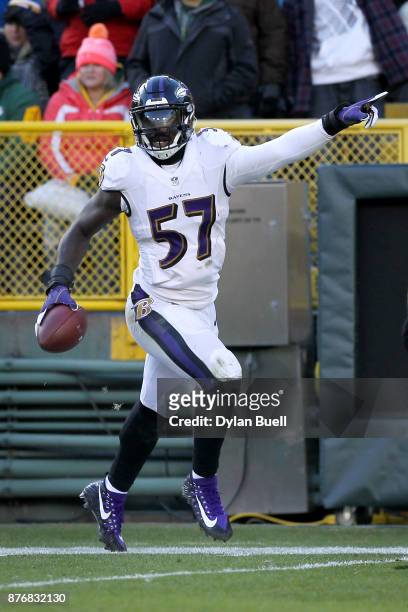 Mosley of the Baltimore Ravens reacts after recovering a fumble in the fourth quarter against the Green Bay Packers at Lambeau Field on November 19,...