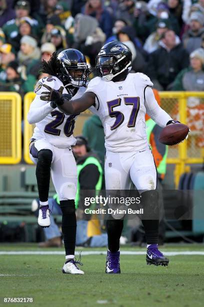 Mosley and Maurice Canady of the Baltimore Ravens celebrate in the fourth quarter against the Green Bay Packers at Lambeau Field on November 19, 2017...