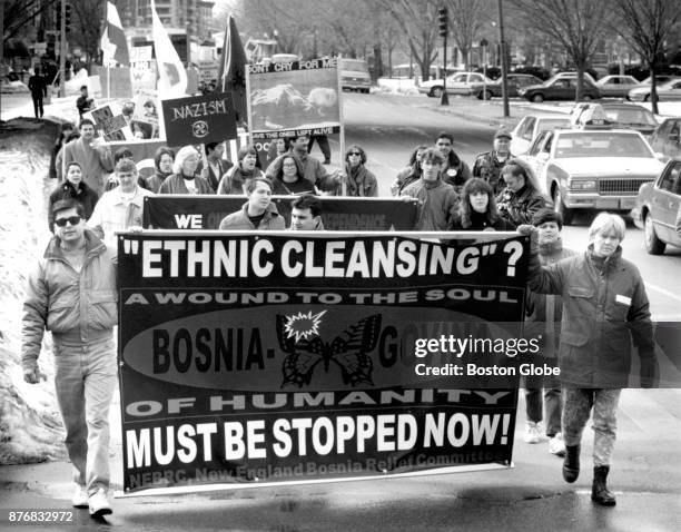 Demonstrators march in Boston on March 20, 1993 to protest "ethnic cleansing," torture and systematic rapes in Bosnia and to call for stronger US and...