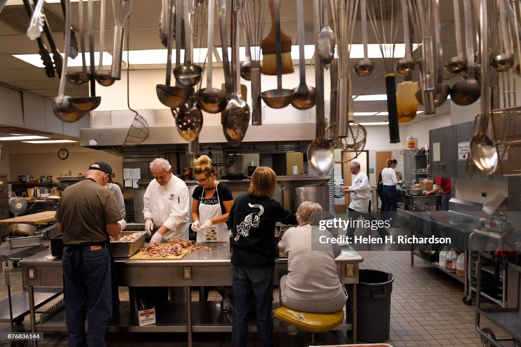 Warren Tech culinary chefs cook food for Thanksgiving for needy people.