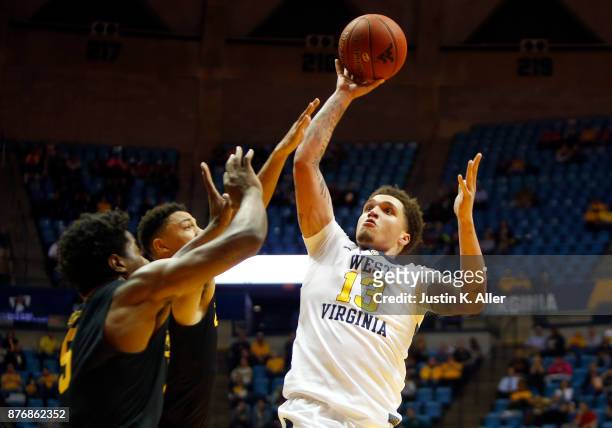 Teddy Allen of the West Virginia Mountaineers takes a shot against the Long Beach State 49ers at the WVU Coliseum on November 20, 2017 in Morgantown,...
