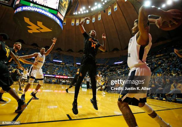 James Bolden of the West Virginia Mountaineers inbounds against KJ Byers of the Long Beach State 49ers at the WVU Coliseum on November 20, 2017 in...