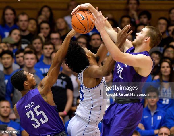 Matt Rafferty of the Furman Paladins blocks Marvin Bagley III of the Duke Blue Devils during their game at Cameron Indoor Stadium on November 20,...