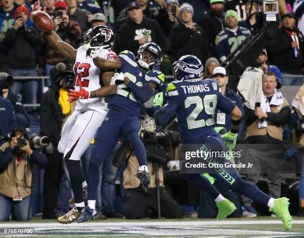 Wide receiver Mohamed Sanu of the Atlanta Falcons brings in a touchdown pass against cornerback Justin Coleman of the Seattle Seahawks and Earl...