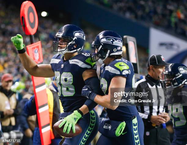 Tight end Jimmy Graham of the Seattle Seahawks celebrates his 4 yard touchdown against the Atlanta Falcons with Luke Willson during the first quarter...
