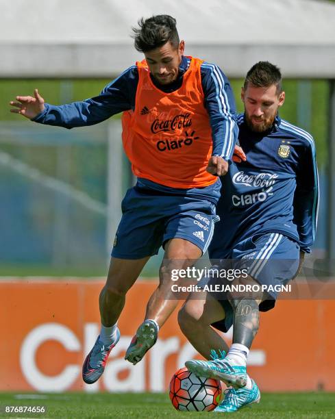 Argentina's forwards Lionel Messi and Lautaro Acosta take part in a training session in Ezeiza, Buenos Aires on October 7, 2017 ahead of a 2018 FIFA...