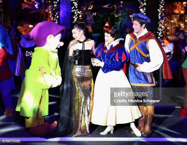 Actress and singer Sofia Carson, is joined by Snow White, The Prince and the Seven Dwarfs when she performs during the 2017 Saks Fifth Avenue Holiday...