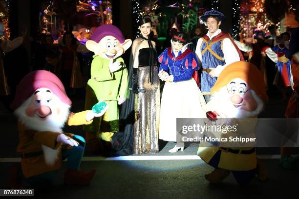 Actress and singer Sofia Carson, is joined by Snow White, The Prince and the Seven Dwarfs when she performs during the 2017 Saks Fifth Avenue Holiday...