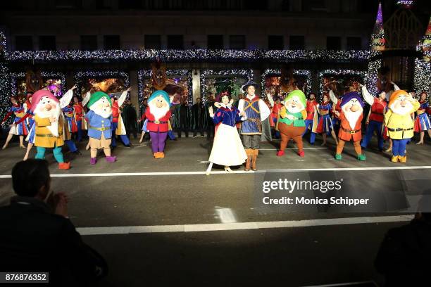 Snow White, The Prince and the Seven Dwarfs perform during the 2017 Saks Fifth Avenue Holiday Window Unveiling And Light Show at Saks Fifth Avenue on...