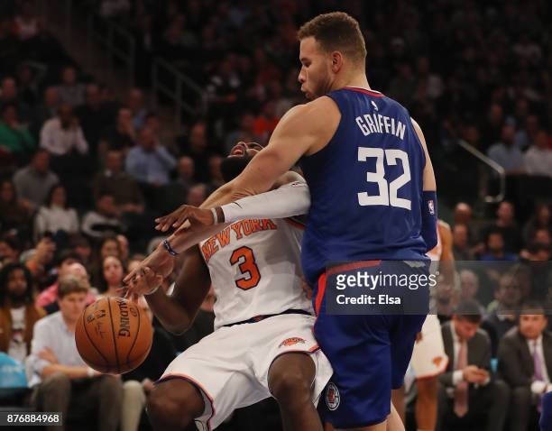 Blake Griffin of the Los Angeles Clippers fouls Tim Hardaway Jr. #3 of the New York Knicks in the fourth quarter at Madison Square Garden on November...