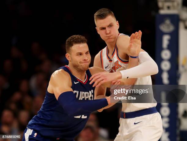 Blake Griffin of the Los Angeles Clippers and Kristaps Porzingis of the New York Knicks fight for position in the second half at Madison Square...