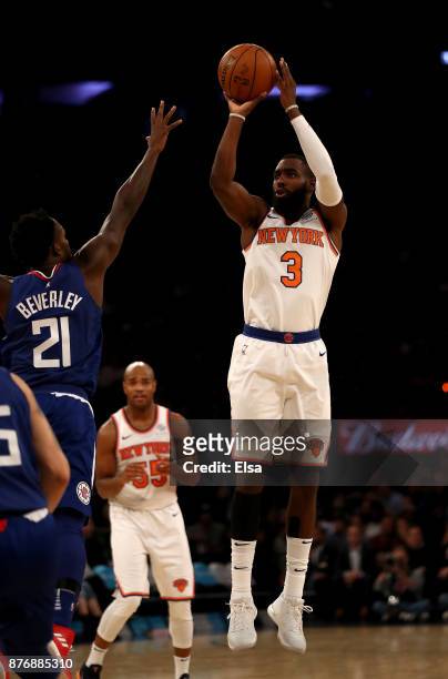 Tim Hardaway Jr. #3 of the New York Knicks takes a shot as Patrick Beverley of the Los Angeles Clippers defends at Madison Square Garden on November...
