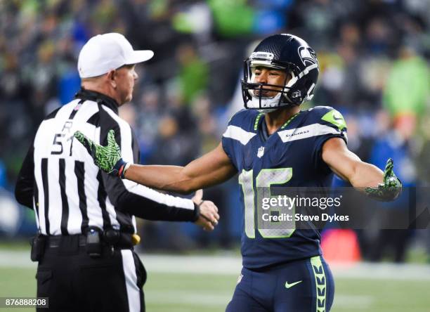 Wide receiver Tyler Lockett of the Seattle Seahawks protests a call by a referee during the second quarter of the game against the Atlanta Falcons at...