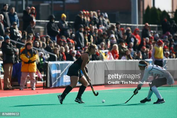 Bodil Keus of the University of Maryland moves the ball past Charlotte Veitner of the University of Connecticut during the Division I Women's Field...